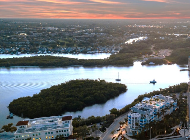 aerial view at dusk with a water view