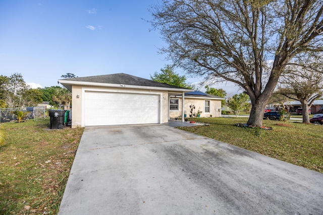 ranch-style house with concrete driveway, solar panels, an attached garage, a front yard, and stucco siding