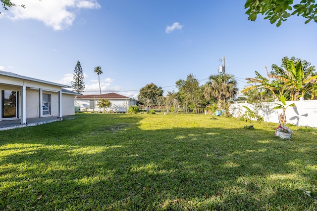 view of yard with fence