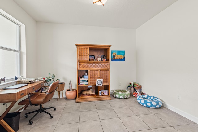 office area featuring baseboards and tile patterned floors