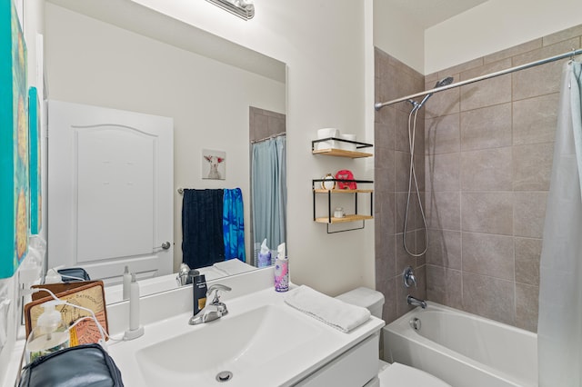 full bath featuring toilet, shower / bathtub combination with curtain, and vanity