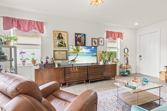 living area with recessed lighting and light tile patterned flooring