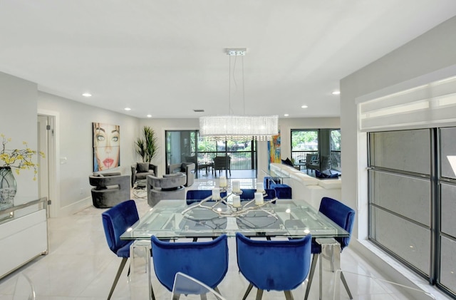 dining room featuring baseboards and recessed lighting