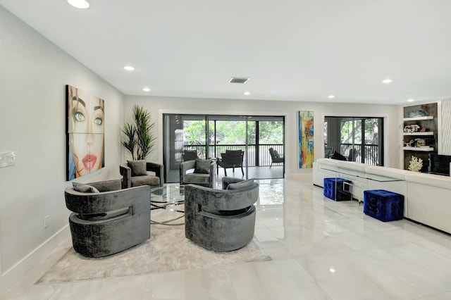 living area featuring baseboards, marble finish floor, visible vents, and recessed lighting