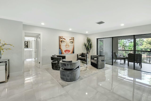 interior space with recessed lighting, marble finish floor, visible vents, and baseboards