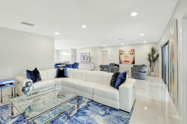 living room featuring recessed lighting and visible vents