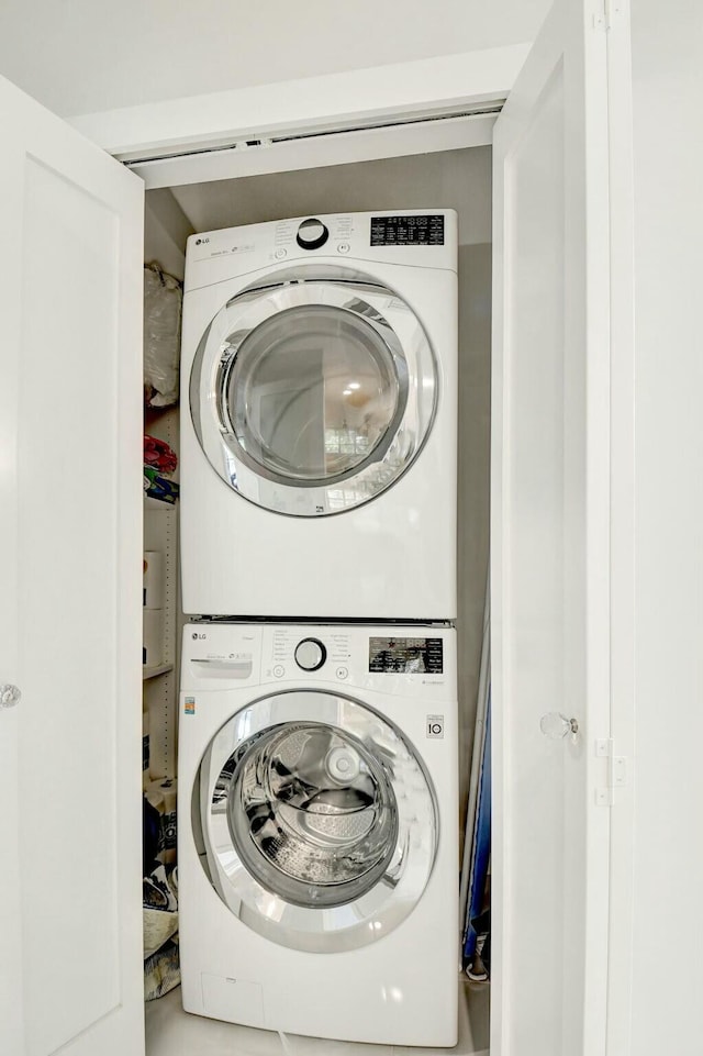 laundry room featuring laundry area and stacked washer / dryer