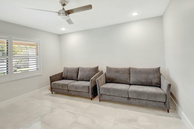 living area with recessed lighting, ceiling fan, and baseboards