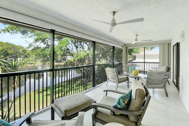 sunroom / solarium with a water view