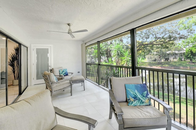 sunroom with a ceiling fan