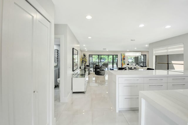 kitchen featuring light countertops, modern cabinets, white cabinetry, and recessed lighting