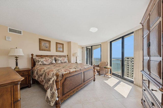 bedroom featuring access to exterior, expansive windows, visible vents, and light tile patterned floors