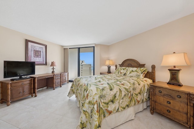 bedroom featuring access to exterior and expansive windows