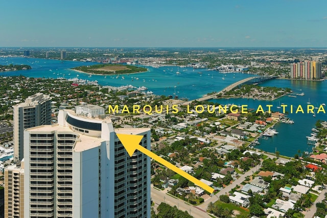 aerial view featuring a view of city and a water view