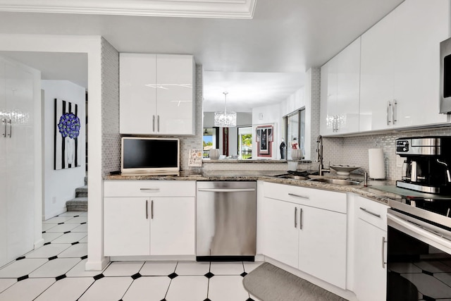 kitchen featuring a sink, white cabinetry, light floors, tasteful backsplash, and crown molding