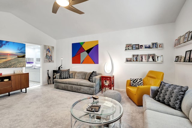 carpeted living room featuring lofted ceiling and ceiling fan