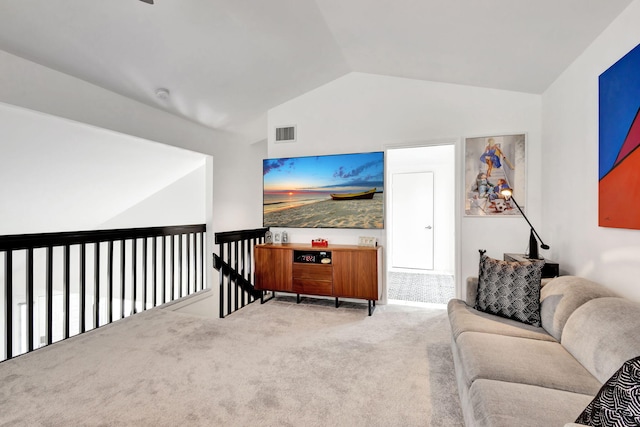 living area with carpet floors, visible vents, and lofted ceiling