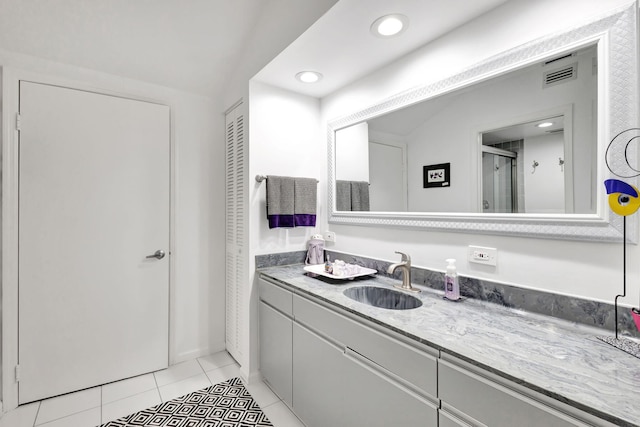 full bath with recessed lighting, visible vents, a shower with shower door, vanity, and tile patterned floors