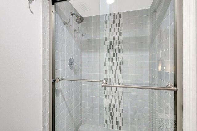 bathroom featuring a shower stall