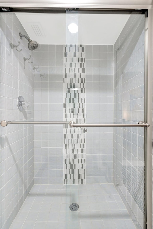 full bath with a shower stall