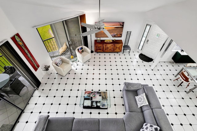 interior space featuring ceiling fan and tile patterned floors