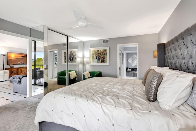 carpeted bedroom with ceiling fan and visible vents