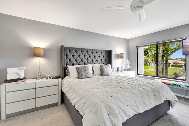 bedroom with light colored carpet and ceiling fan