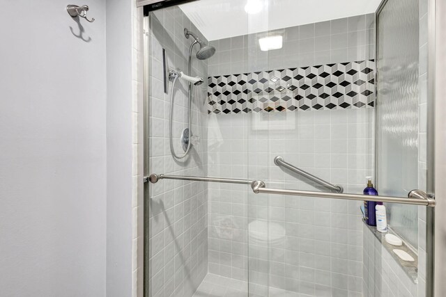 bathroom with a shower stall