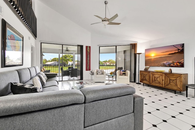 living room featuring ceiling fan, light floors, and high vaulted ceiling