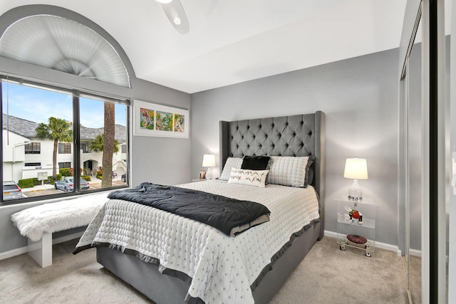 carpeted bedroom featuring baseboards