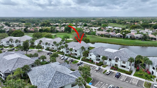 aerial view with a water view and a residential view