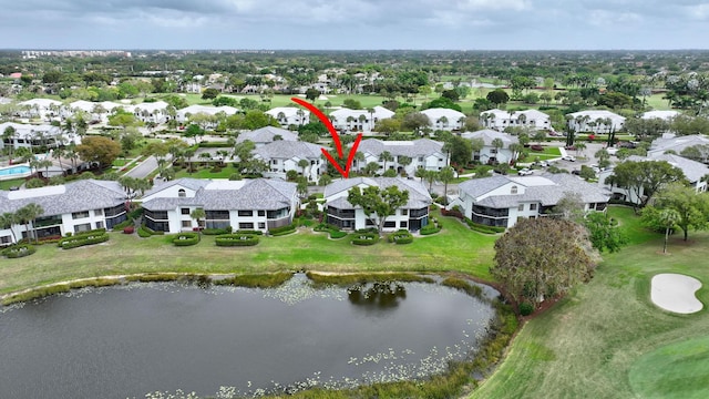 drone / aerial view with a water view and a residential view