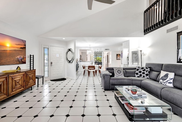 living room featuring light floors, visible vents, high vaulted ceiling, and ceiling fan with notable chandelier