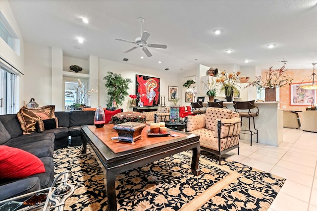 living room featuring light tile patterned floors, ceiling fan, and recessed lighting