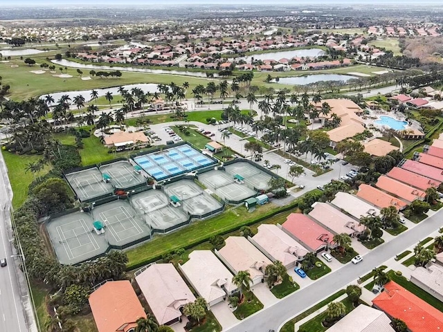 bird's eye view featuring a residential view, view of golf course, and a water view