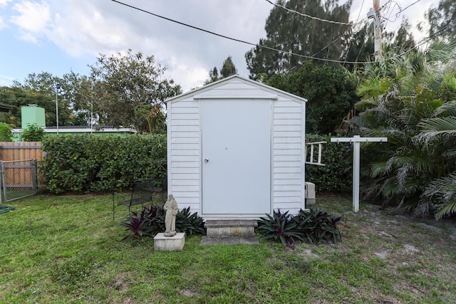 view of shed with fence