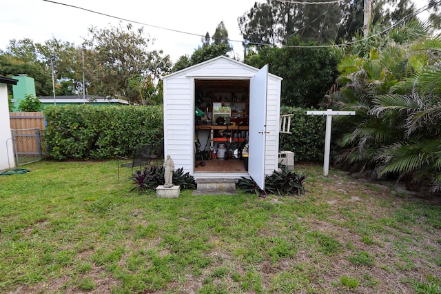 view of shed with fence