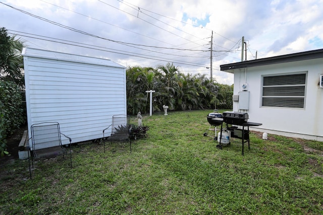 view of yard with a shed and an outdoor structure