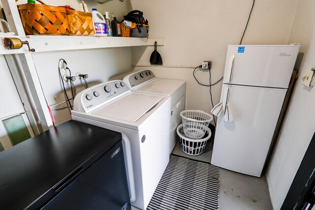 washroom with laundry area and separate washer and dryer