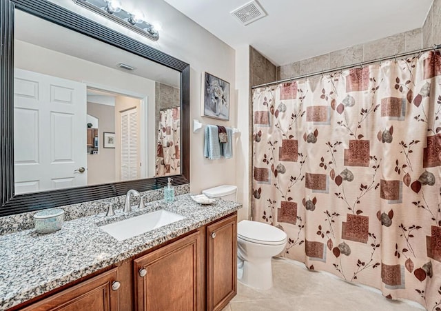 bathroom featuring visible vents, a shower with shower curtain, toilet, vanity, and tile patterned flooring