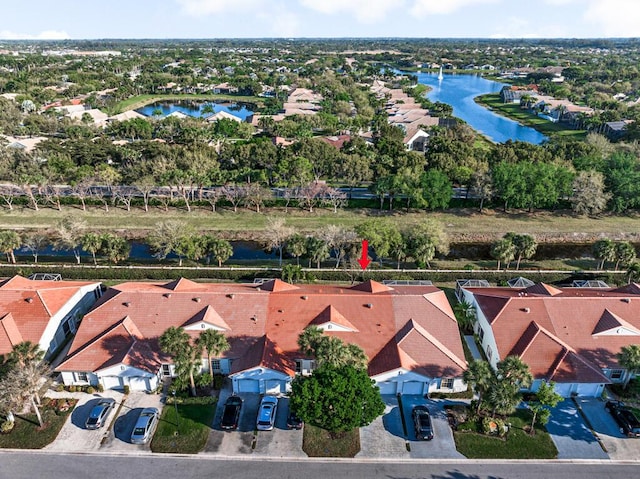 bird's eye view with a water view and a residential view