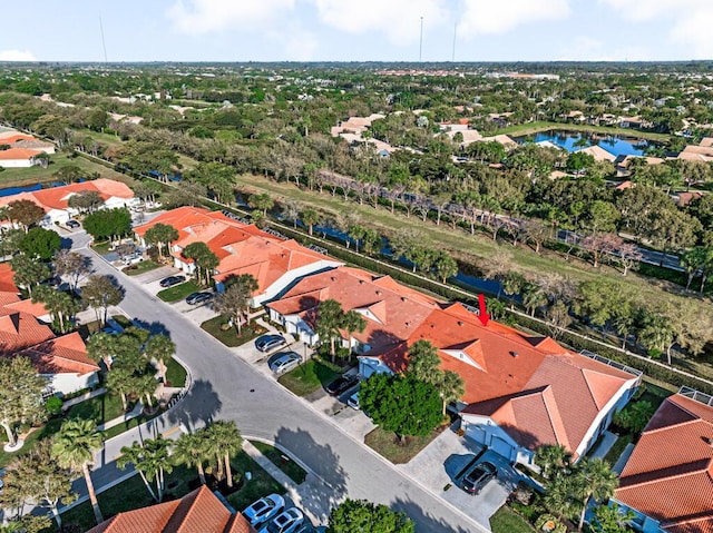 birds eye view of property featuring a residential view and a water view