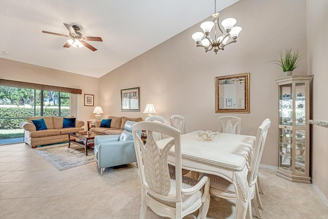 dining space featuring lofted ceiling, light tile patterned floors, baseboards, and ceiling fan with notable chandelier