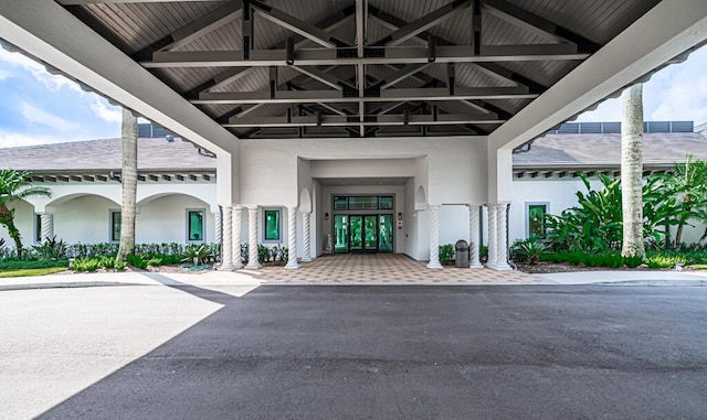 entrance to property with stucco siding