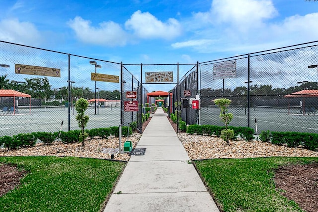 view of tennis court with fence