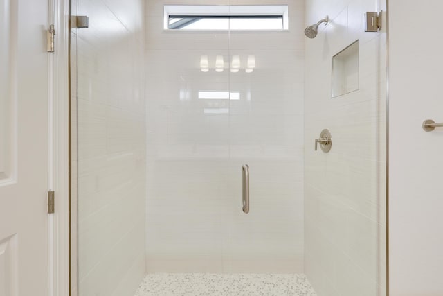 full bathroom featuring a stall shower