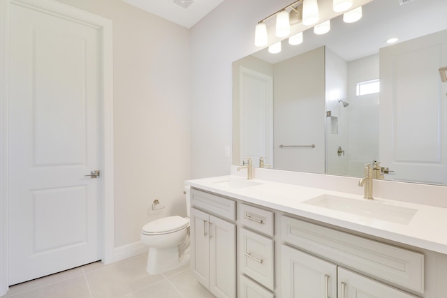 full bathroom featuring walk in shower, a sink, toilet, and tile patterned floors