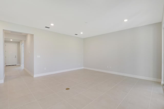 empty room with recessed lighting, visible vents, baseboards, and light tile patterned floors