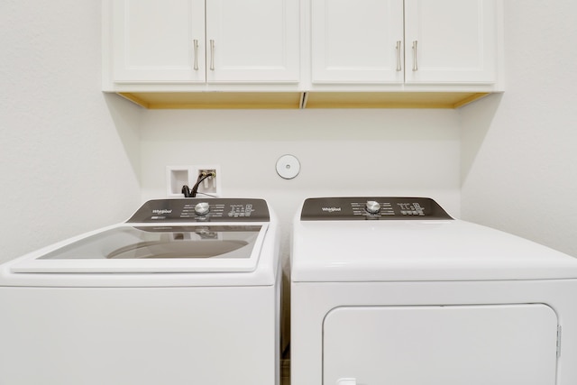 laundry area with cabinet space and washer and dryer