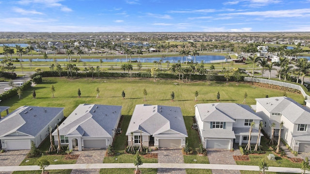 bird's eye view featuring a residential view and a water view